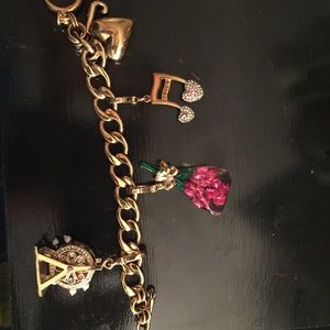 Juicy couture bracelet with 3 charms included
