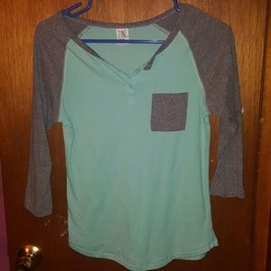 Light blue with gray sleeves pocket tee.