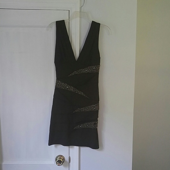Mini dress. Fitted, with beautiful bead work!