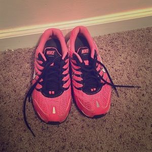 Size 6.5 pink Nike Air shoes.