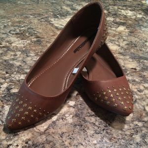 Brown flats with metal studs