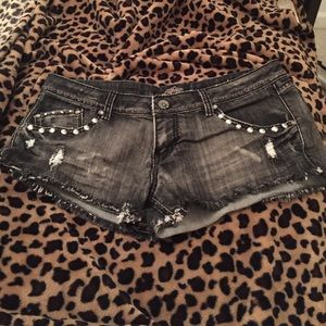 Distressed studded shorts