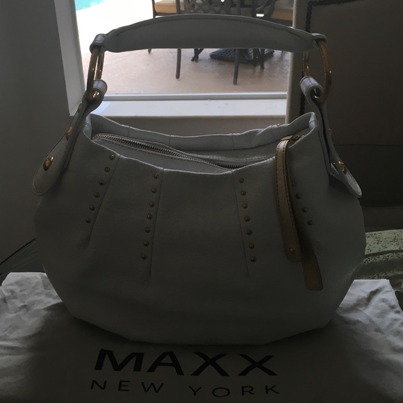 White and gold bag . Maxx New York