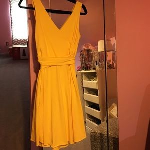 Yellow sleeveless wrap dress