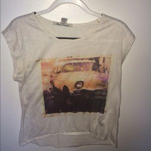A t-shirt with a faded picture of a car