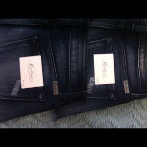 Cut off shorts with wash on pockets. Brand new