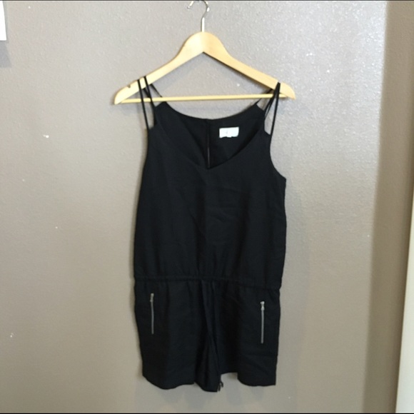 Black romper with silver zipper pockets