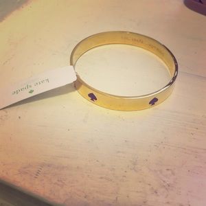 ✨NWT✨ Gold Kate Spade bangle with purple logoNWT