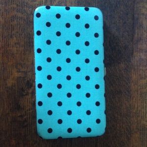 blue and black polka dot wallet