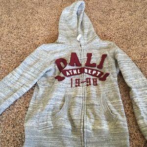 Greg and maroon zip up sweater