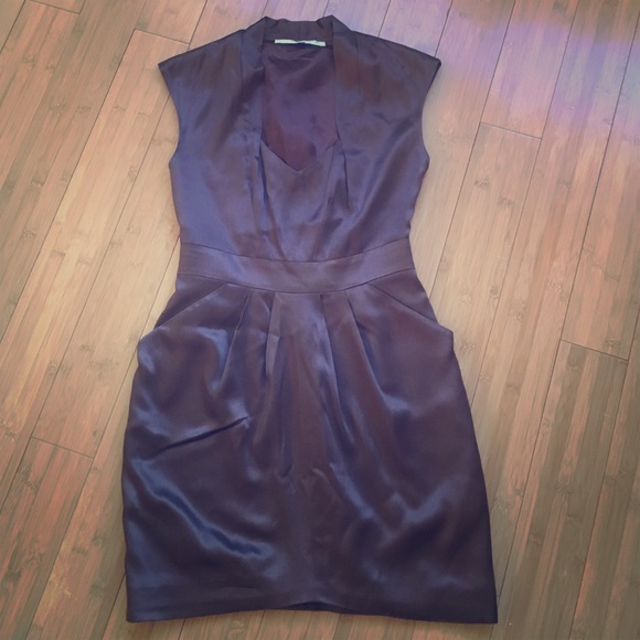 Silk dress with cap sleeves and pockets.