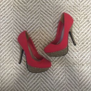 Red tribal high heals.