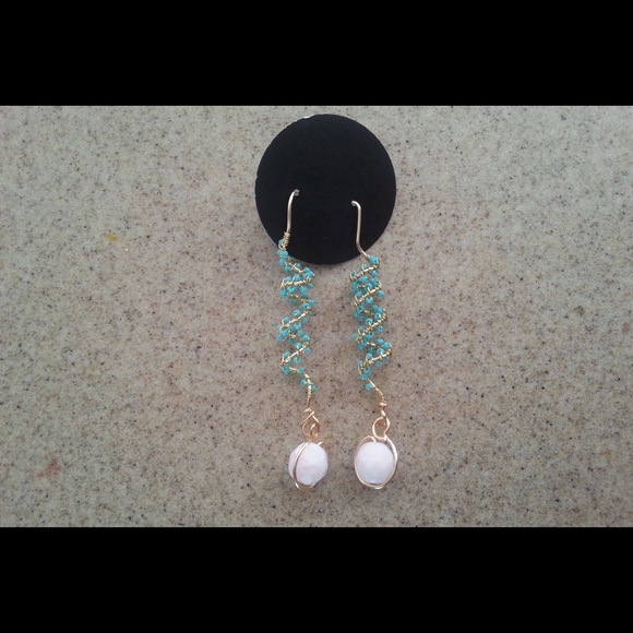 Beautiful teal beaded dangles with pink bead.