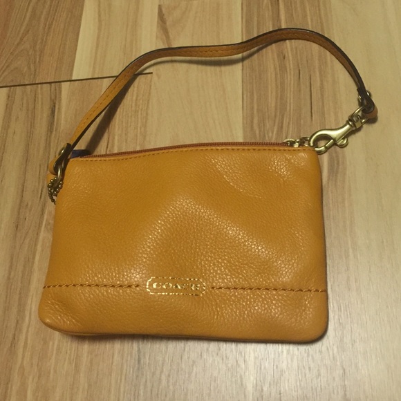 Coach orange wristlet