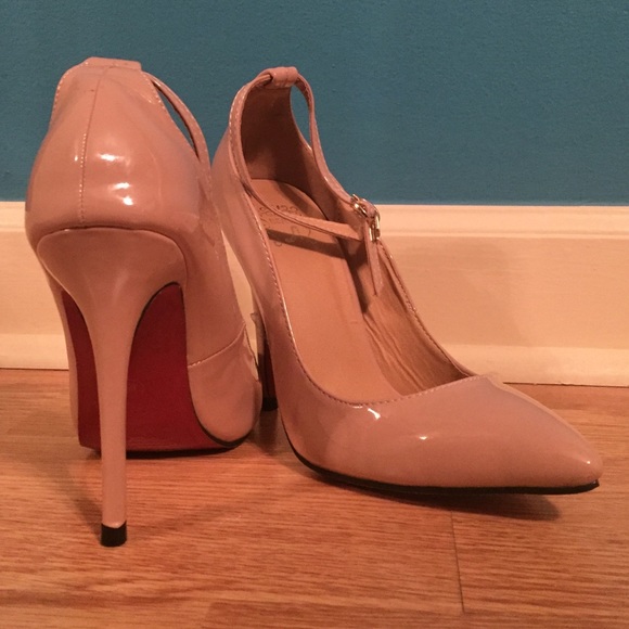 Tan pointed heels with red soles