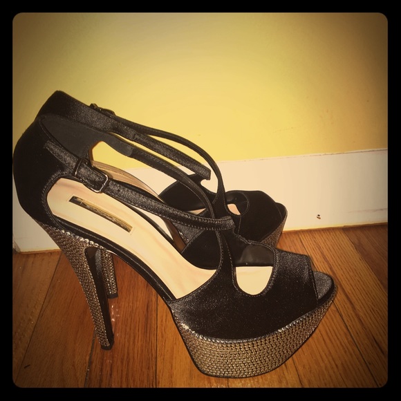 Black satin pumps