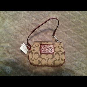 PRICE DROP! tan and red wristlet! NWT!