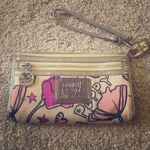 Coach poppy wristlet/wallet stain shown in picture