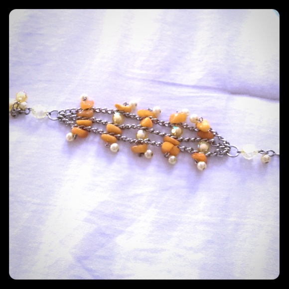 Hand-crafted orange/yellow/beige bead bracelet