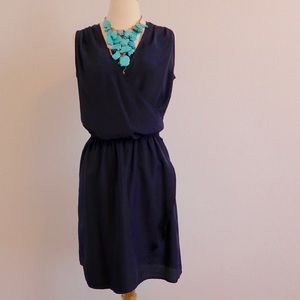 HOLD. Navy Faux Wrap Sleeveless Dress