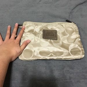 Mini coach bag. Good for makeup! Never used