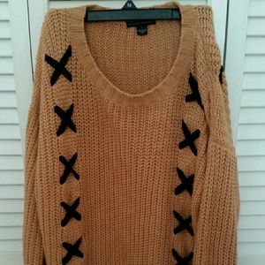 Pink knit sweater with X design