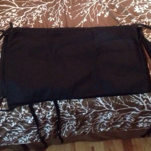 Set of two 3-pocket aprons.