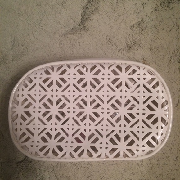White patent leather makeup bag .