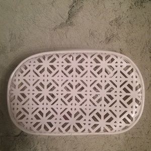 White patent leather makeup bag .