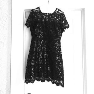 Black evening dress. Mid thigh length.
