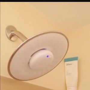 Shower head with built in Bluetooth speaker