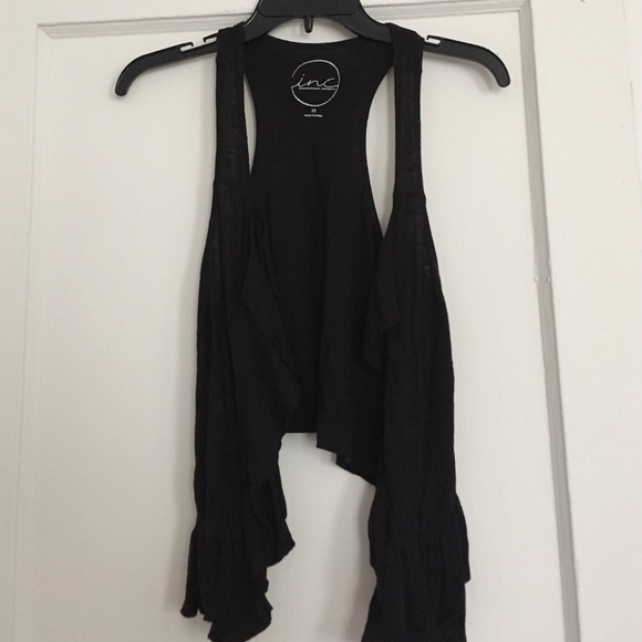 Black vest with ruffle detail
