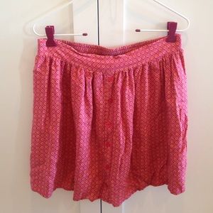 Short flowy pink skirt