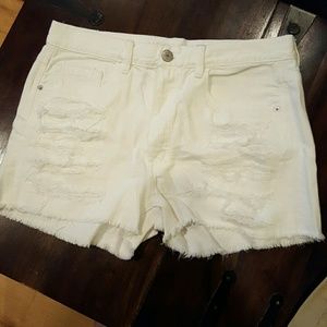Distressed white AE shorts