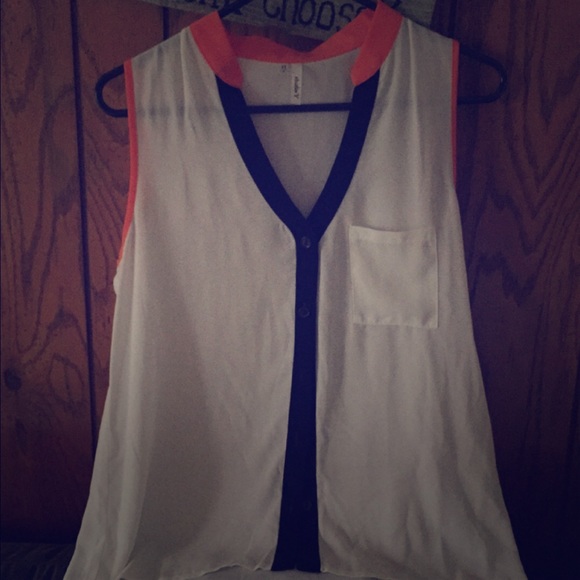 White Maurices tank with blue and orange trim.