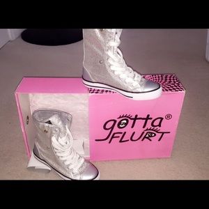 Silver sequenced converse high tops