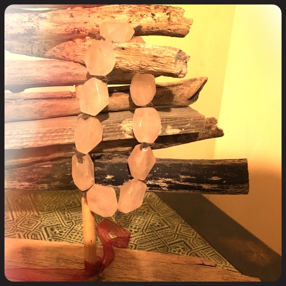 Light pink (Quartz?) and leather bauble bracelet