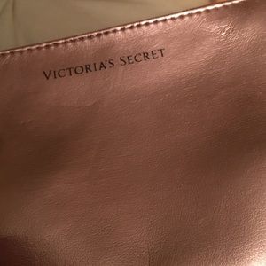 bundle of vs lipgloss, makeup bag, and body mist