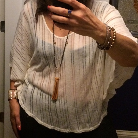Cream batwing knit w/ sheer striping. High cut hip