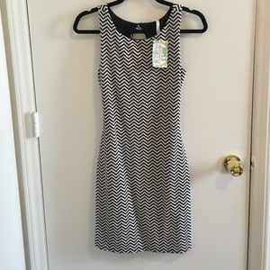 Black and white chevron body con open back dress