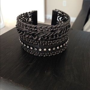 Black metal bracelet with cubic zirconia.