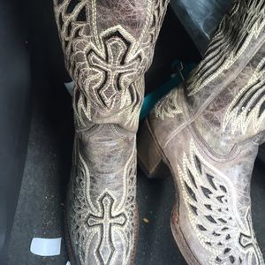 Pointed boots, brush, rag, and boot tree.