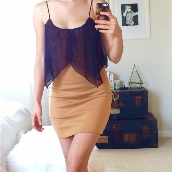 Bodycon dress with black overlay.