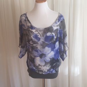 Blue and gray floral print top with open back