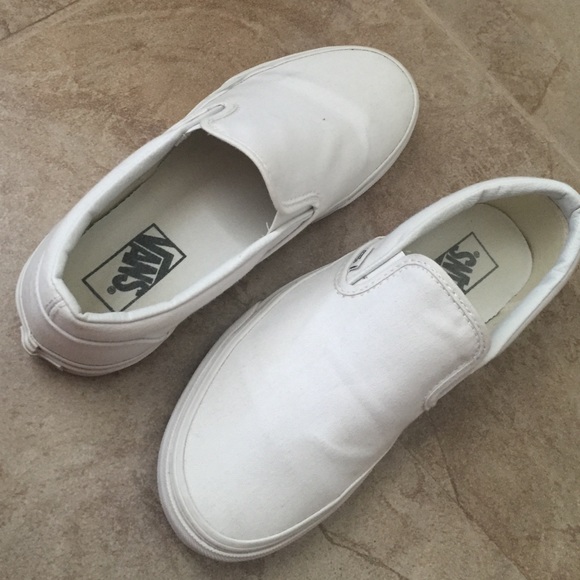 All white slip on Vans