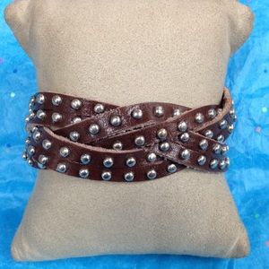 Brown leather bracelet with silver colored beads