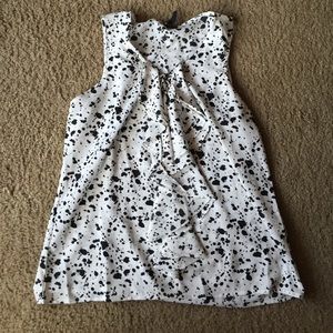 Black and white sleeveless blouse
