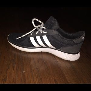 Black and white Adidas tennis shoes