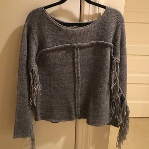 Sweater with fringe arms. Never worn, brand new