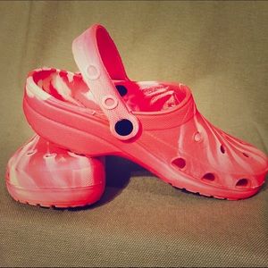 Pink and white crocs